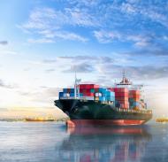 A cargo ship travels at sea